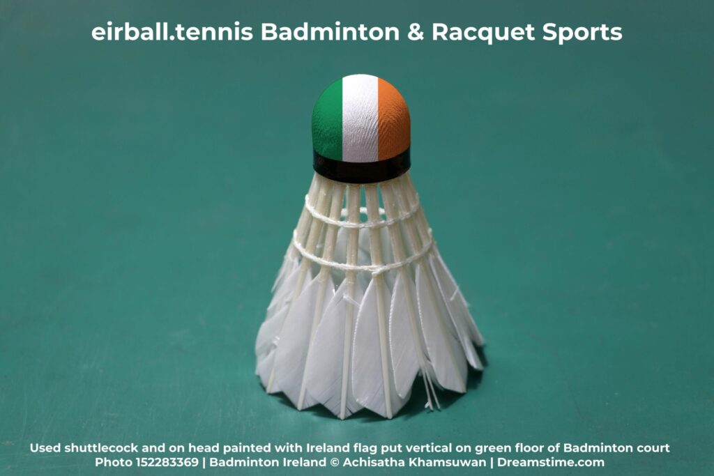 Used shuttlecock and on head painted with Ireland flag put vertical on green floor of Badminton court